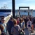 Pier 50 with many passengers waiting to board as others exit the Water Taxi.