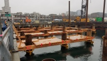 Crews install falsework at the future site of King County Water Taxi Passenger Only Ferry (POF) facility on the Seattle waterfront.